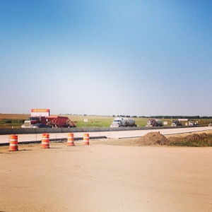 Truck traffic and road construction in Ray, North Dakota. 